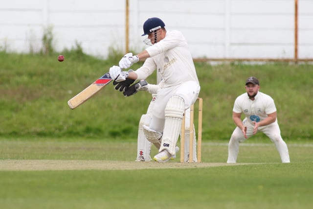 Worksop's Tim Smith Jnr hits a boundary against Whitwell.