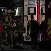 Firefighters at the scene in Sutton, south London, where four children have died following a fire at a house.
