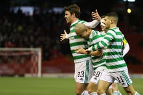 Celtic's Matt O'Riley runs to celebrates with the visiting support at Pittodrie after claiming his first goal for the club. His deflecred effort made it 2-0 in an ultimately tense encounter, eventually won 3-2 by Ange  Postecoglou's men after they were pegged back to 2-2.  (Photo by Craig Williamson / SNS Group)