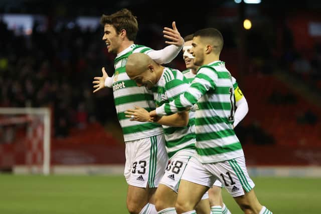 Celtic's Matt O'Riley runs to celebrates with the visiting support at Pittodrie after claiming his first goal for the club. His deflecred effort made it 2-0 in an ultimately tense encounter, eventually won 3-2 by Ange Postecoglou's men after they were pegged back to 2-2. (Photo by Craig Williamson / SNS Group)