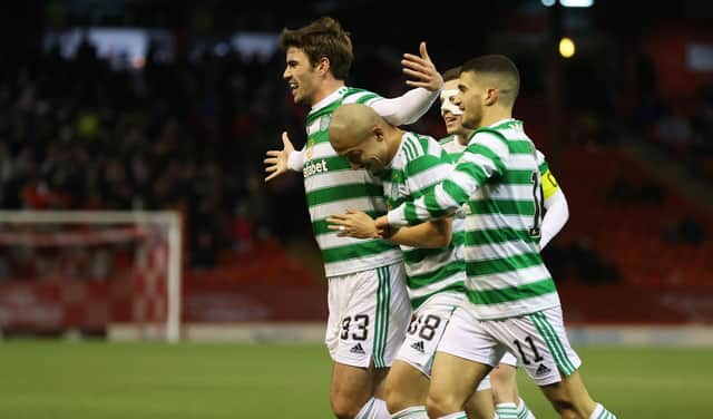 Celtic's Matt O'Riley runs to celebrates with the visiting support at Pittodrie after claiming his first goal for the club. His deflecred effort made it 2-0 in an ultimately tense encounter, eventually won 3-2 by Ange  Postecoglou's men after they were pegged back to 2-2.  (Photo by Craig Williamson / SNS Group)