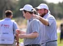 Shane Lowry congratulates Bob MacIntyre after one of his wins for Great Britain and Ireland in the inaugural Hero Cup in Abu Dhabi. Picture: Ross Kinnaird/Getty Images.