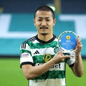 Daizen Maeda of Celtic poses for a photo after being awarded player of the match against Livingston.
