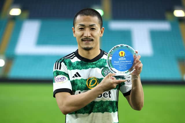 Daizen Maeda of Celtic poses for a photo after being awarded player of the match against Livingston.