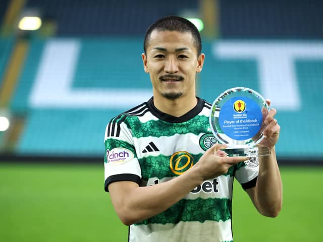 Daizen Maeda of Celtic poses for a photo after being awarded player of the match against Livingston.