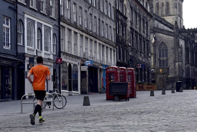 A runner takes his one allotted exercise on the Royal Mile, Edinburgh (Picture: Lisa Ferguson)