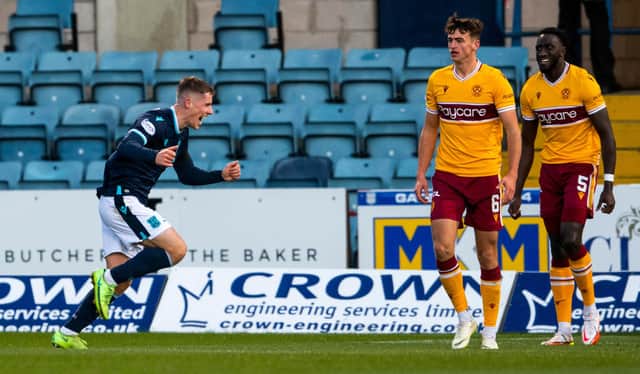 Luke McCowan celebrates after scoring to make it 1-0 to Dundee.