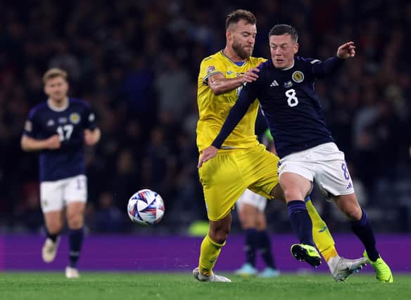 Andriy Yarmolenko of Ukraine and Callum McGregor of Scotland tussle for possession during Wednesday's match at Hampden.
