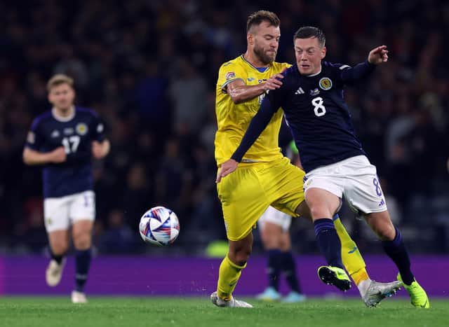 Andriy Yarmolenko of Ukraine and Callum McGregor of Scotland tussle for possession during Wednesday's match at Hampden.