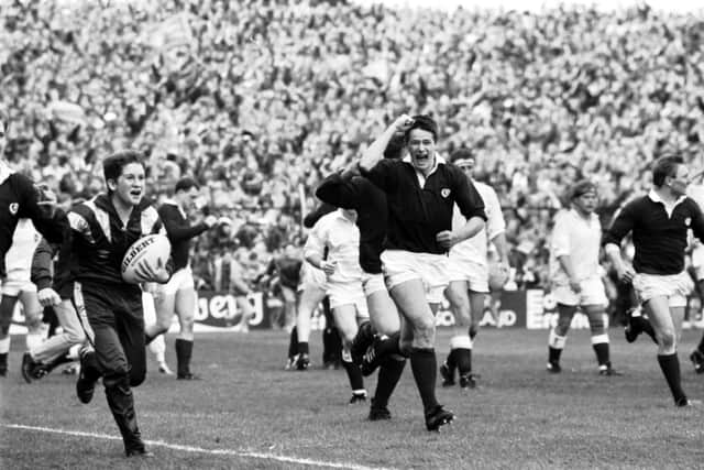 A moment in Scottish sporting history as Tony Stanger celebrates the 13-7 win over England which clinched the Grand Slam in 1990. Picture: Alan MacDonald