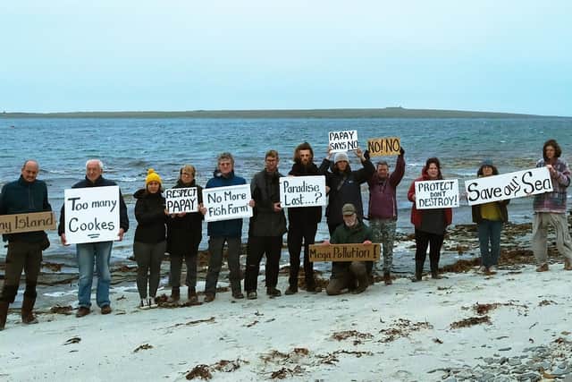 Protesters from campaign group No East Moclett turned out on the Orkney island of Papa Westray calling for plans to build a giant fish farm there to be scrapped
