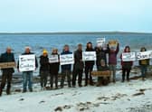 Protesters from campaign group No East Moclett turned out on the Orkney island of Papa Westray calling for plans to build a giant fish farm there to be scrapped