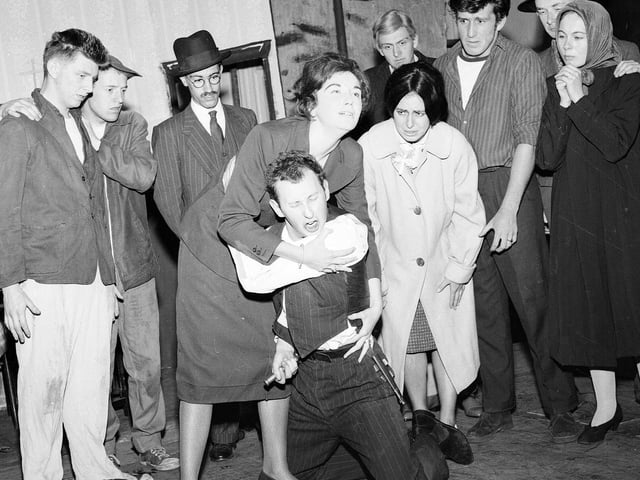 Members of the 60 Group rehearsing Arthur Miller's 'A View from the Bridge', one of their Edinburgh Festival Fringe shows,  in 1963. The man being held at front is Michael Cronin, best known for playing Mr 'Bullet' Baxter in Grange Hill.