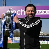 Cove Rangers manager Paul Hartley with the cinch League One trophy. (Photo by Ross MacDonald / SNS Group)