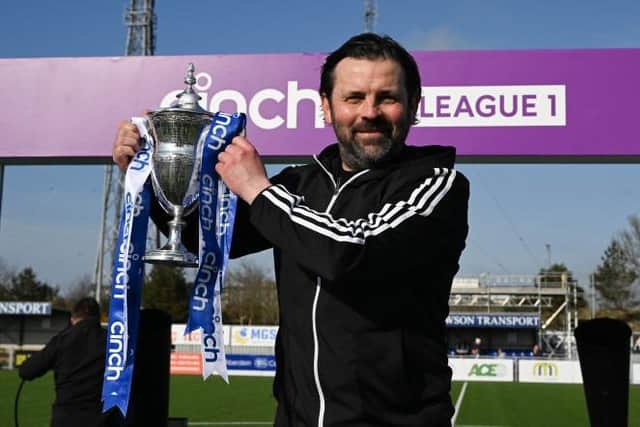Cove Rangers manager Paul Hartley with the cinch League One trophy. (Photo by Ross MacDonald / SNS Group)