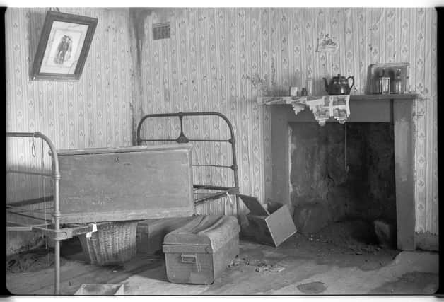 Inside cottage number 3 where a bed, trunks and mouse-eaten wallpaper were found. 
Photo by Robert Atkinson, (c) University of Edinburgh, Robert Atkinson Collection, School of Scottish Studies Archives (SSSA RA-Coll S292).