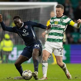 Celtic's Callum McGregor and Ross County's Victor Loturi in action.
