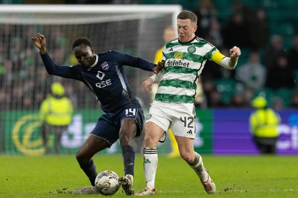 Celtic's Callum McGregor and Ross County's Victor Loturi in action.