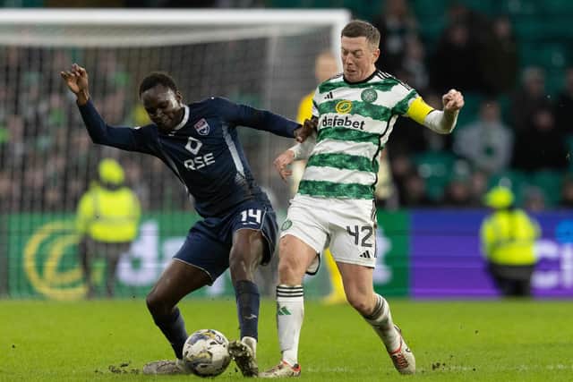 Celtic's Callum McGregor and Ross County's Victor Loturi in action.