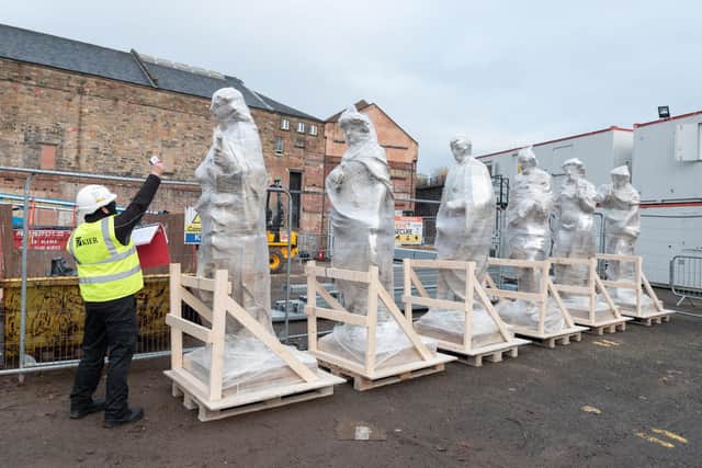 The statues have returned to the Citizens ahead of being lifted onto the top of the venue.