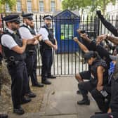 People kneel in front of police during a Black Lives Matter protest in London in June 2020 (Picture: Justin Setterfield/Getty Images)