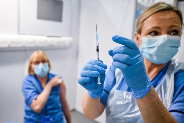 A patient receives the coronavirus vaccine at the Louisa Jordan Hospital in Glasgow. Photo: Jeff J Mitchell - Pool /Getty Images/