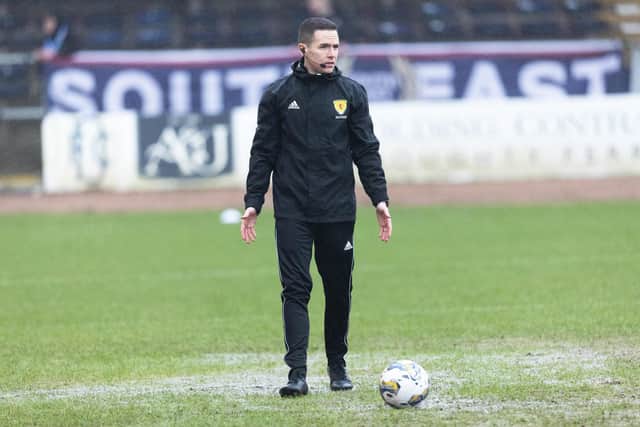 Referee David Munro conducts a pitch inspection prior to calling off the match between Dundee and Aberdeen at Dens Park. (Photo by Mark Scates / SNS Group)