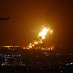 An Aramco oil depot close to the circuit is seen in flames following an incident during practice ahead of the F1 Grand Prix of Saudi Arabia at the Jeddah Corniche Circuit on March 25, 2022 in Jeddah, Saudi Arabia. (Photo by Lars Baron/Getty Images)