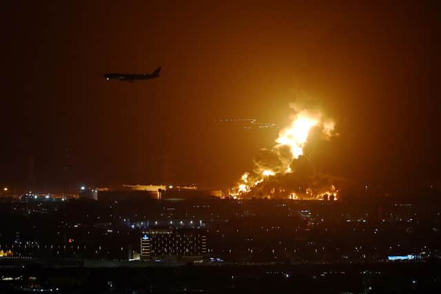 An Aramco oil depot close to the circuit is seen in flames following an incident during practice ahead of the F1 Grand Prix of Saudi Arabia at the Jeddah Corniche Circuit on March 25, 2022 in Jeddah, Saudi Arabia. (Photo by Lars Baron/Getty Images)