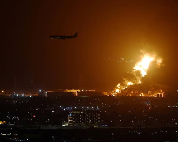 An Aramco oil depot close to the circuit is seen in flames following an incident during practice ahead of the F1 Grand Prix of Saudi Arabia at the Jeddah Corniche Circuit on March 25, 2022 in Jeddah, Saudi Arabia. (Photo by Lars Baron/Getty Images)