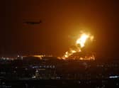 An Aramco oil depot close to the circuit is seen in flames following an incident during practice ahead of the F1 Grand Prix of Saudi Arabia at the Jeddah Corniche Circuit on March 25, 2022 in Jeddah, Saudi Arabia. (Photo by Lars Baron/Getty Images)