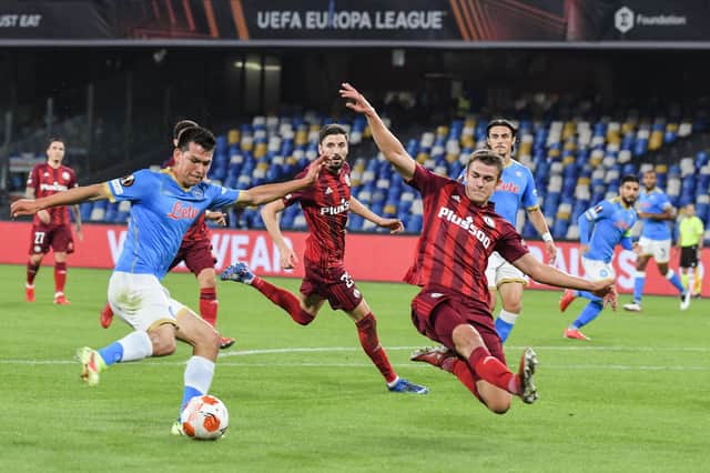Legia Warsaw's Maik Nawrocki tries to block a shot from Napoli's Hirving Lozano during a Europa League clash.