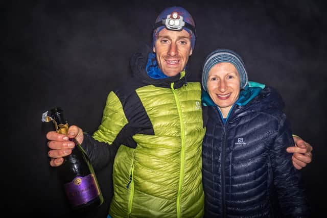 Mr Campbell celebrates with his wife, Rachael, after finishing the challenge on Ben Hope in Sutherland at 5.02am this morning (Wednesday).