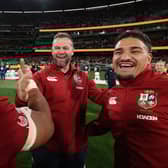Sione Tuipulotu, right, celebrates with head coach Andy Farrell and Bundee Aki (L) after the British & Irish Lions beat Australia in the second Test at the Melbourne Cricket Ground to clinch the series. Tuipulotu missed the match through injury. (Photo by David Rogers/Getty Images)