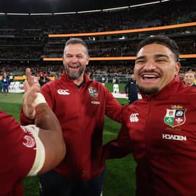 Sione Tuipulotu, right, celebrates with head coach Andy Farrell and Bundee Aki (L) after the British & Irish Lions beat Australia in the second Test at the Melbourne Cricket Ground to clinch the series. Tuipulotu missed the match through injury. (Photo by David Rogers/Getty Images)