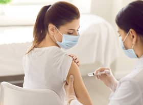 A young woman receives a Covid-19 jab at a new modern vaccination centre