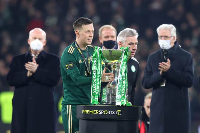 Celtic's Callum McGregor lifts the trophy from the podium after winning the Premier Sports Cup Final at Hampden Park, Glasgow. (Jeff Holmes/PA Wire).