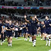 Scotland players greet supporters after defeating Romania 84-0 at the Rugby World Cup. (Photo by SAMEER AL-DOUMY/AFP via Getty Images)