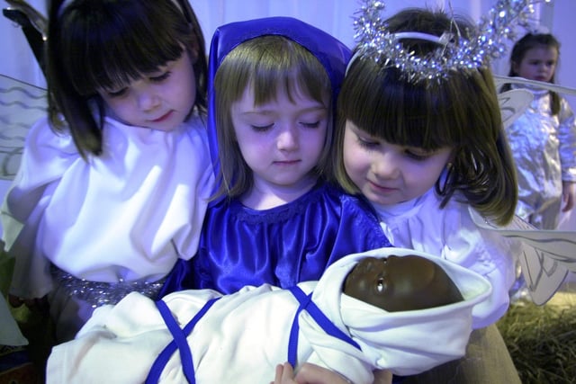 From left to right we have Kirsty Miller, Rebecca McKean and Robyn Johnstone taking on the roles of angels and Mary for their school’s Christmas nativity play from 2001. Picture: 12 December 2001