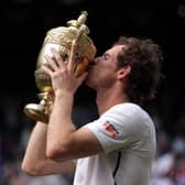 Andy Murray celebrates winning the Men's Singles Final on day thirteen of the Wimbledon Championships at the All England Lawn Tennis and Croquet Club, Wimbledon.