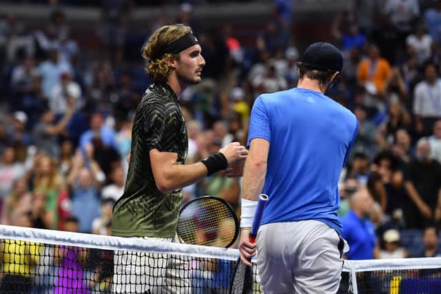 Andy Murray and Stefanos Tsitsipas shake hands after their match at the US Open in 2021.