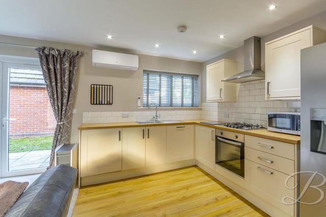 This is the shaker-style kitchen section of the open-plan hub. Estate agents BuckleyBrown describe it as "enviable", with its range of modern units, cabinets and worktops, and its handy, integrated appliances, including oven and dishwasher. There is also an inset sink and drainer, gas hob with stainless steel extractor fan, space for a double fridge/freezer and laminate flooring.