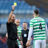 Bobby Madden shows Shane Duffy of Celtic a yellow card. (Photo by Ian MacNicol/Getty Images)