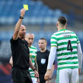 Bobby Madden shows Shane Duffy of Celtic a yellow card. (Photo by Ian MacNicol/Getty Images)