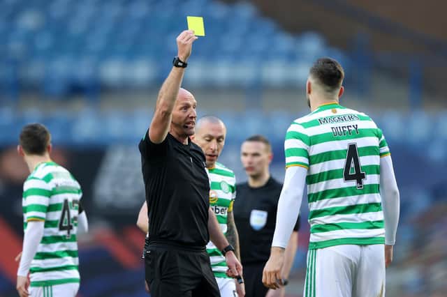 Bobby Madden shows Shane Duffy of Celtic a yellow card. (Photo by Ian MacNicol/Getty Images)