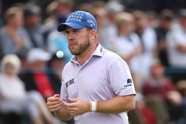 A dejected Richie Ramsay leaves the 18th green at the Sutton Coldfield venue on Sunday after having to settle for a share of third spot with fellow Scot Connor Syme. Picture: Andrew Redington/Getty Images.