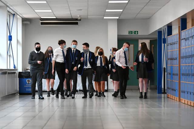 Pupils wearing face masks and coverings at Holyrood Secondary School in Glasgow last year. Picture: John Devlin