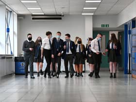 Pupils wearing face masks and coverings at Holyrood Secondary School in Glasgow last year. Picture: John Devlin