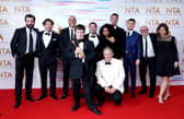 Tommy Jessop (centre), Martin Compston, Gregory Piper, Craig Parkinson, Daniel Mays and the cast and crew of Line of Duty in the press room after winning the Special Recognition Award at the National Television Awards 2021 held at the O2 Arena, London.
