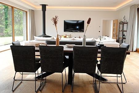 The open plan living area includes a bright dining space.